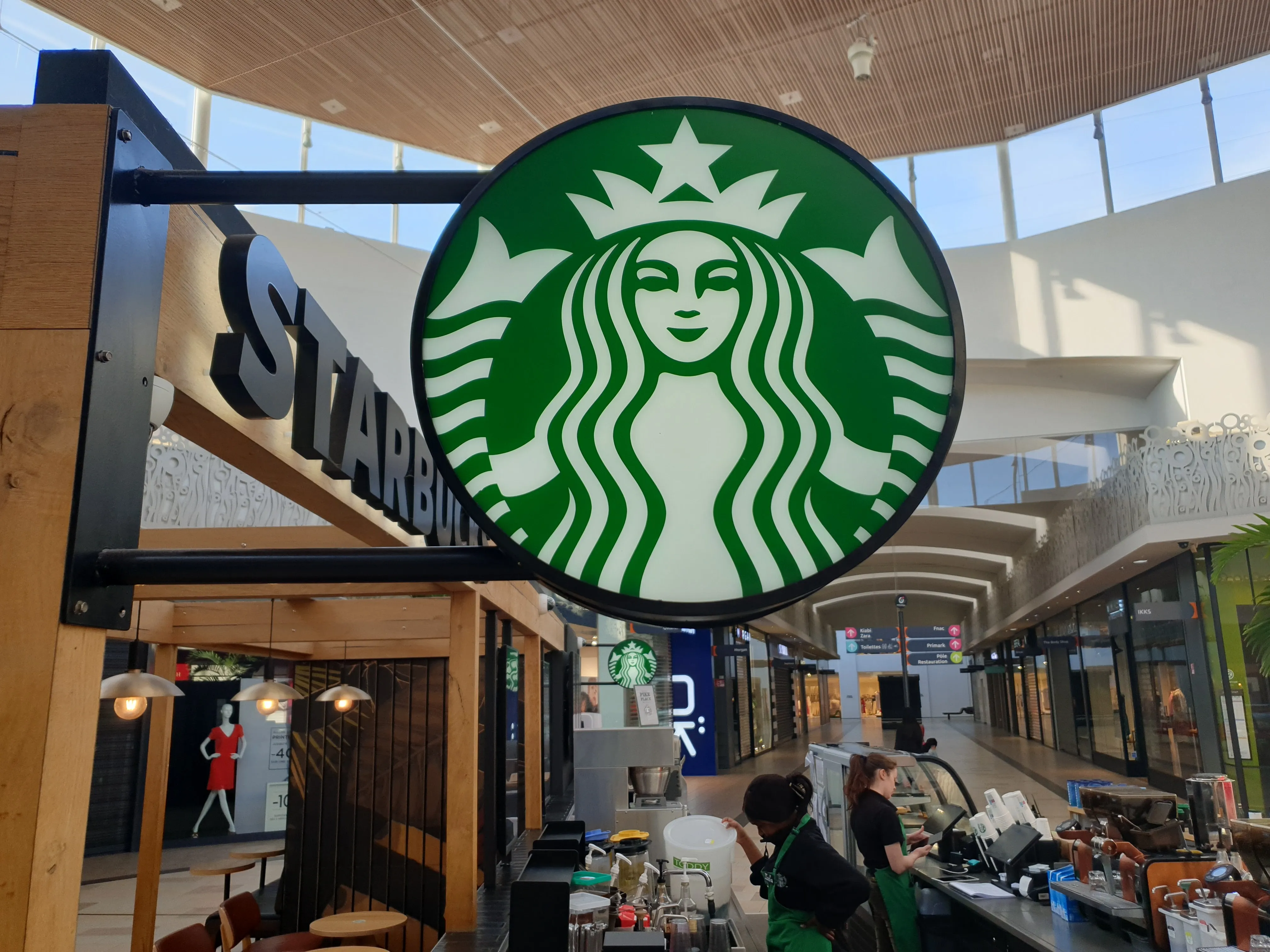 Enseigne drapeau lettre rétroéclairée Starbucks à Bordeaux